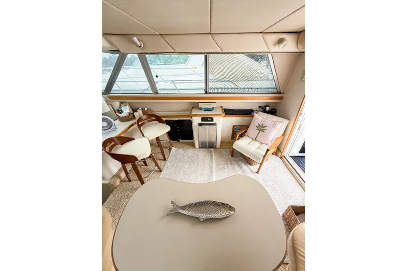 Slide: The Image of Interior of 1995 Sea Ray 370 Sedan Bridge with seating and decor. - 11