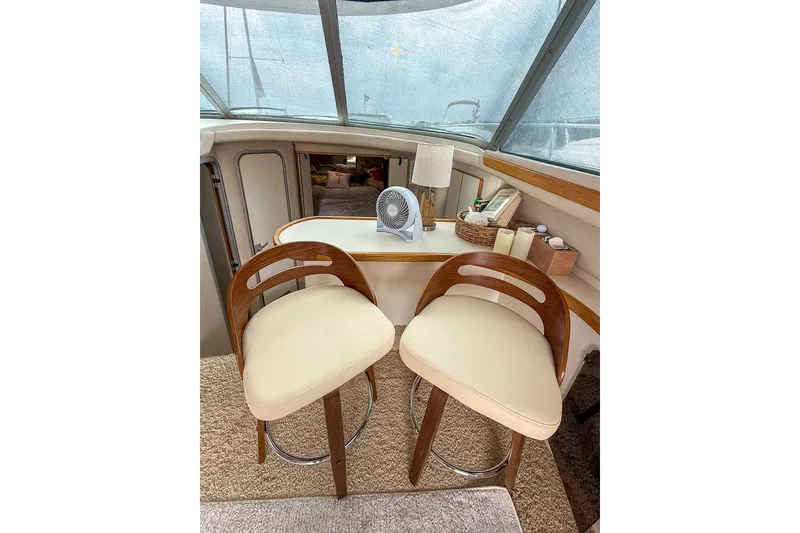 Slide: The Image of Interior of 1995 Sea Ray 370 Sedan Bridge with stylish seating and accessories. - 14