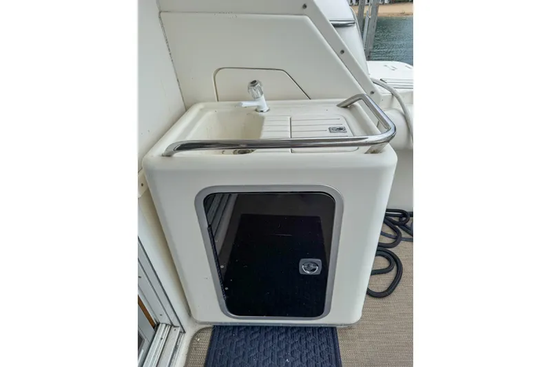 Slide: The Image of Outdoor sink and storage on 1995 Sea Ray 370 Sedan Bridge yacht deck. - 8