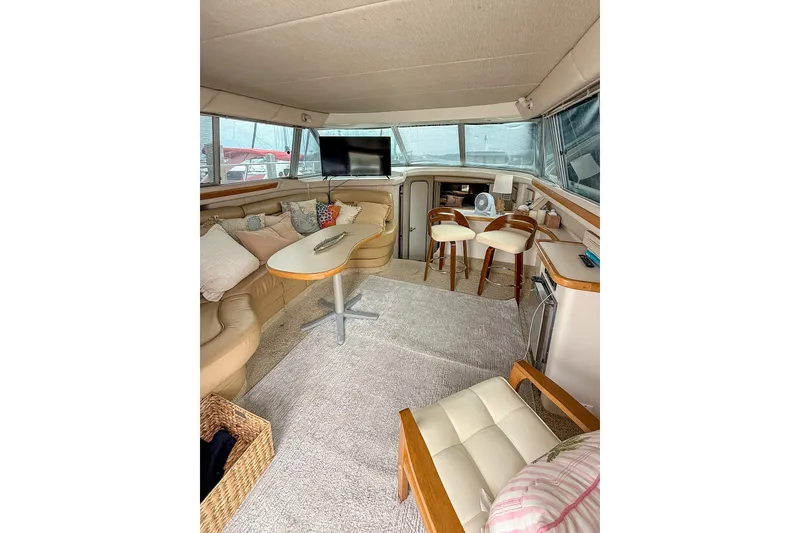 Slide: The Image of Luxurious interior of a 1995 Sea Ray 370 Sedan Bridge yacht with comfortable seating. - 9