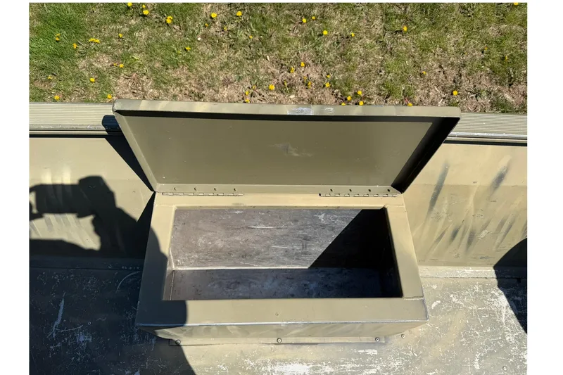 Slide: The Image of Open storage compartment in 2008 Tracker Grizzly 1648 T Blind Duck Edition boat. - 11