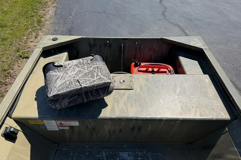 Slide: The Image of 2008 Tracker Grizzly 1648 T Blind Duck Edition boat interior with storage compartments. - 12