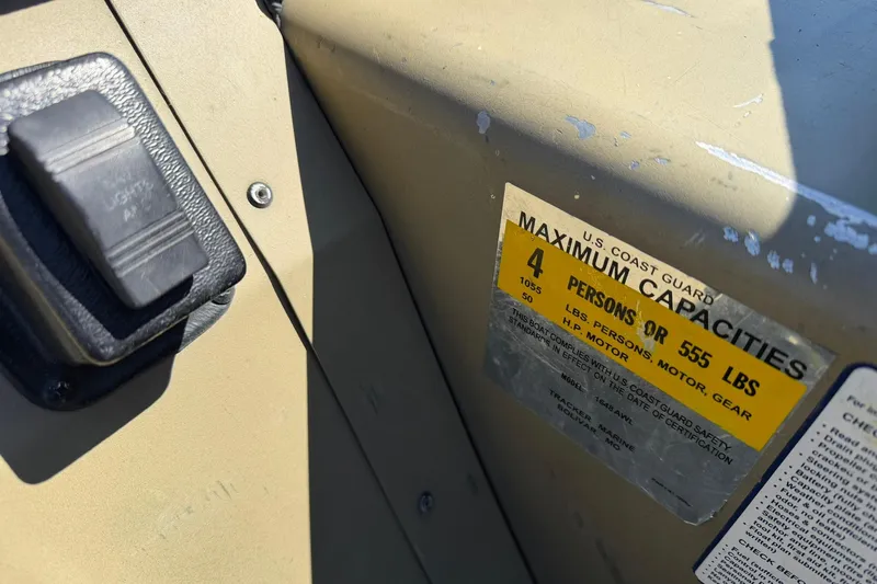 Slide: The Image of 2008 Tracker Grizzly 1648 T Blind Duck Edition capacity label, showing maximum weight and persons allowed. - 13