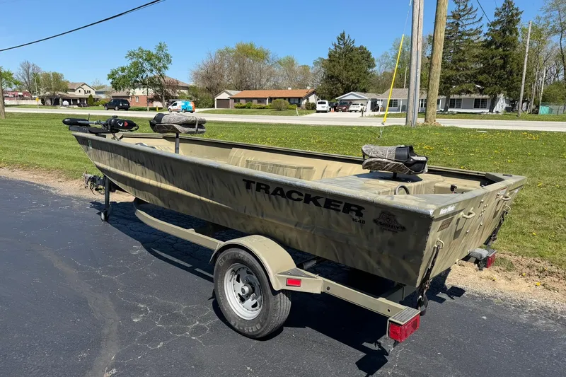 Slide: The Image of 2008 Tracker Grizzly 1648 T Blind Duck Edition boat on trailer, parked outdoors. - 3