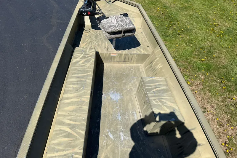 Slide: The Image of 2008 Tracker Grizzly 1648 T Blind Duck Edition boat with camouflage seating and storage compartments. - 5