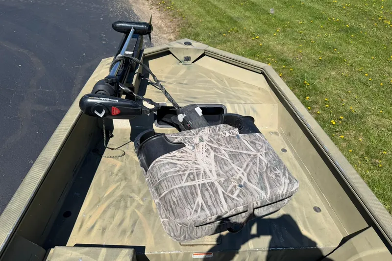 Slide: The Image of 2008 Tracker Grizzly 1648 T Blind Duck Edition boat with camouflage seat and trolling motor. - 6