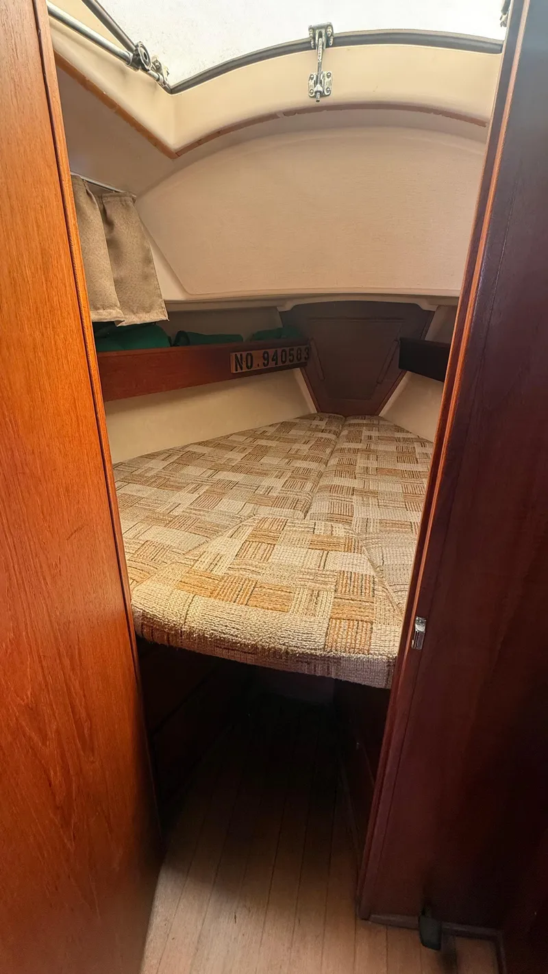 Slide: The Image of Interior cabin of a 1981 Sabre 28 sailboat with a cozy sleeping area. - 11