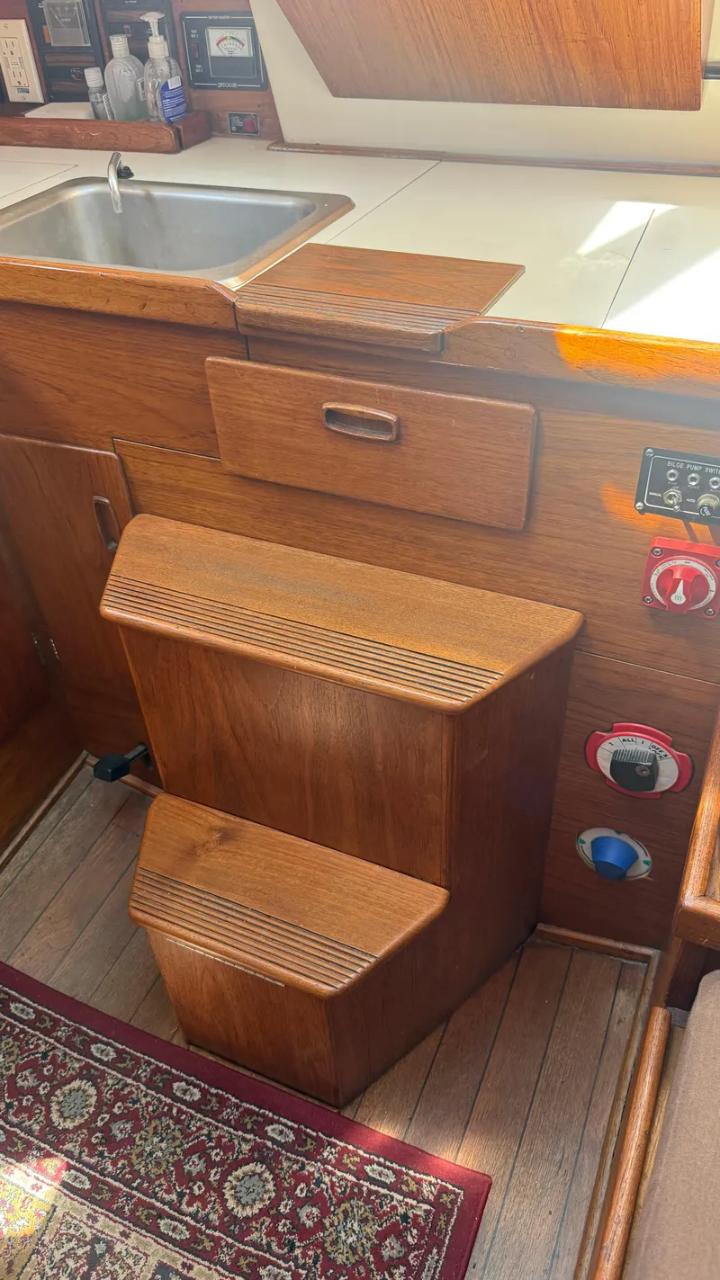 Slide: The Image of Interior of 1981 Sabre 28 sailboat with wooden cabinetry and sink. - 19