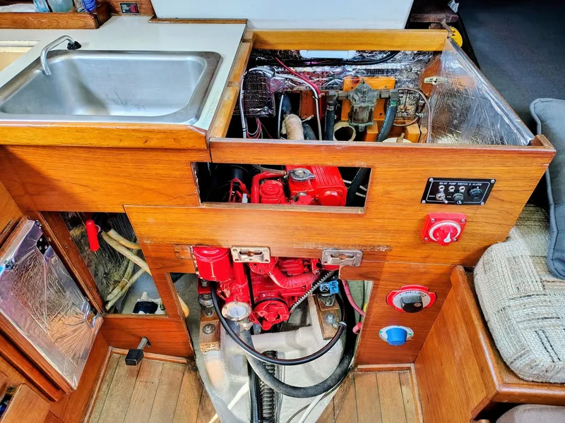 Slide: The Image of 1981 Sabre 28 yacht interior showing engine compartment and sink area. - 21