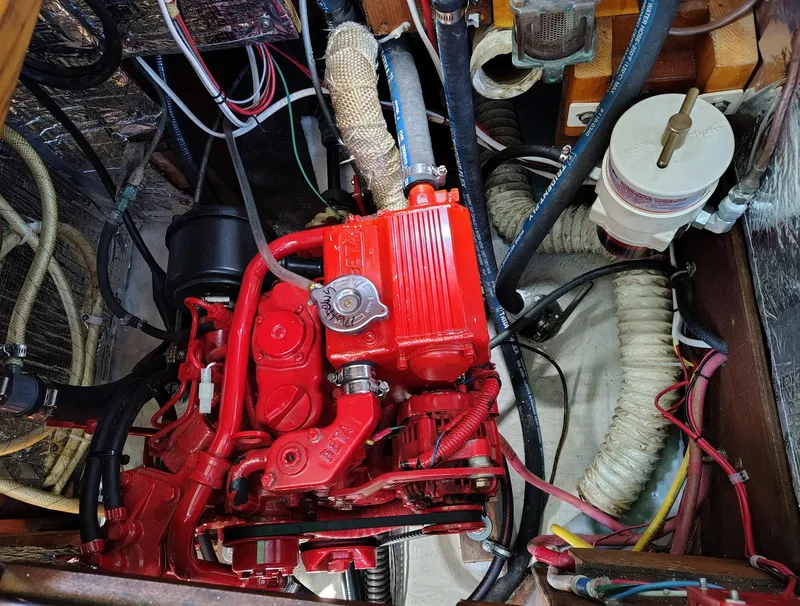 Slide: The Image of Engine compartment of a 1981 Sabre 28 sailboat with red Beta Marine engine. - 22