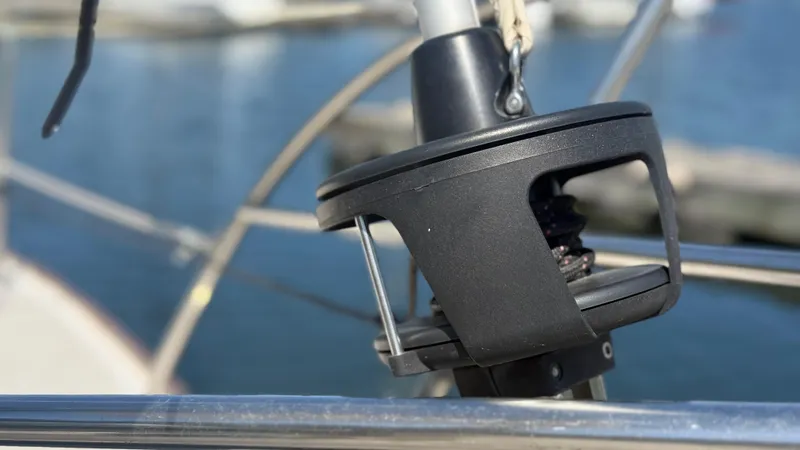 Slide: The Image of Close-up of a 1981 Sabre 28 sailboat's rigging mechanism by the water. - 28