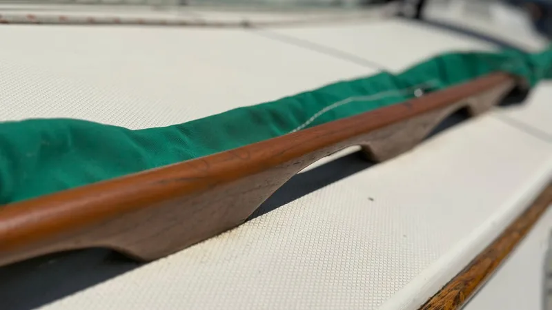 Slide: The Image of Close-up of a 1981 Sabre 28 sailboat deck with green canvas cover. - 39