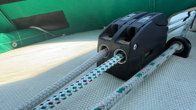 Slide: The Image of Close-up of a 1981 Sabre 28 sailboat's rope clutches and lines on deck. - 44