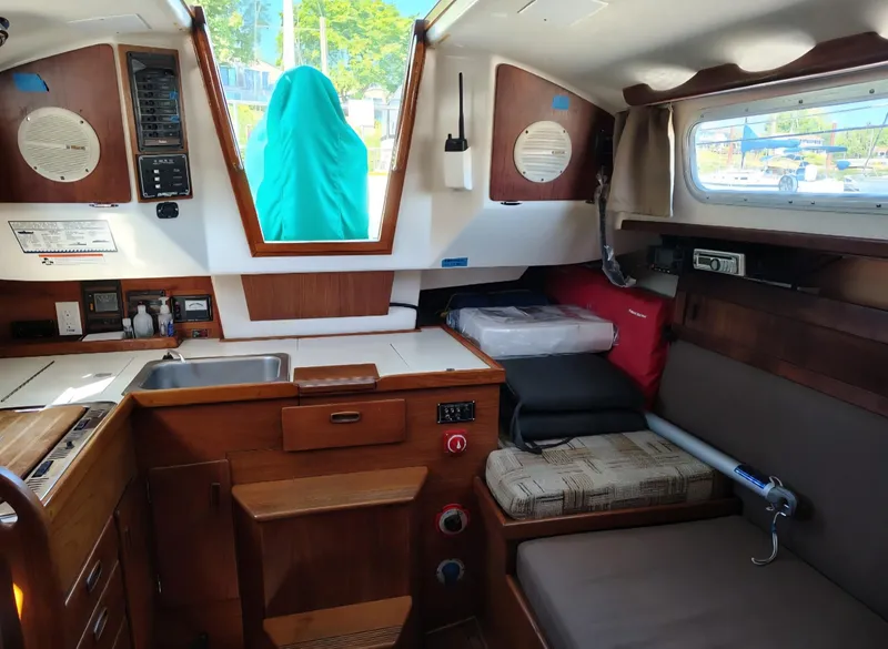 Slide: The Image of Interior of a 1981 Sabre 28 sailboat with wood cabinetry and seating. - 7