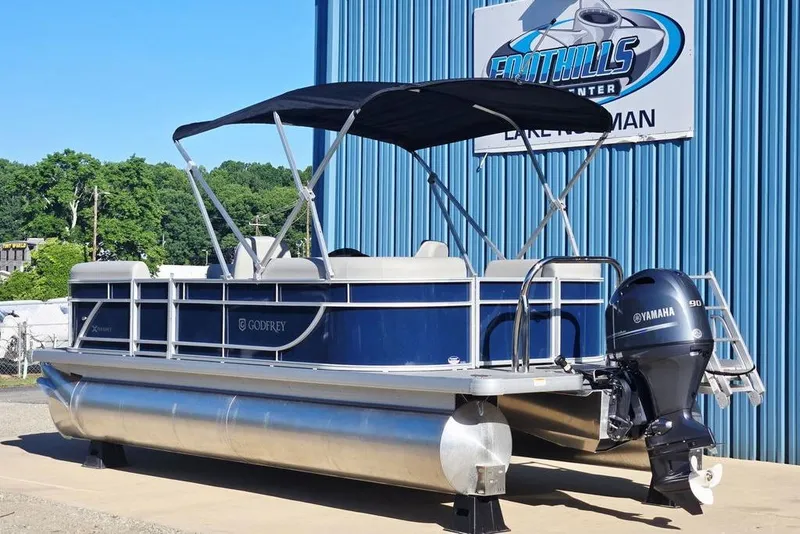 The Image of 2025 Godfrey Xperience 2086 SBX pontoon boat with Yamaha motor, parked outdoors. - 0