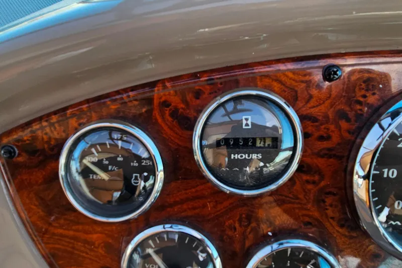 Slide: The Image of Dashboard of a 2001 Maxum 3500 SCR boat showing gauges and hour meter. - 17