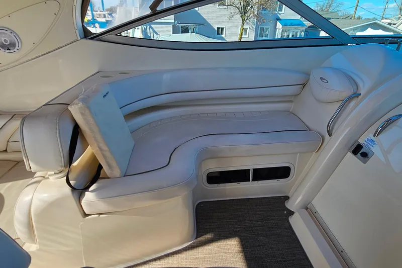 Slide: The Image of Interior of a 2001 Maxum 3500 SCR boat featuring cream leather seating. - 19