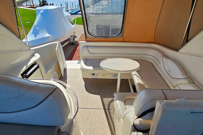 Slide: The Image of Interior of 2001 Maxum 3500 SCR yacht with beige seating and table. - 21