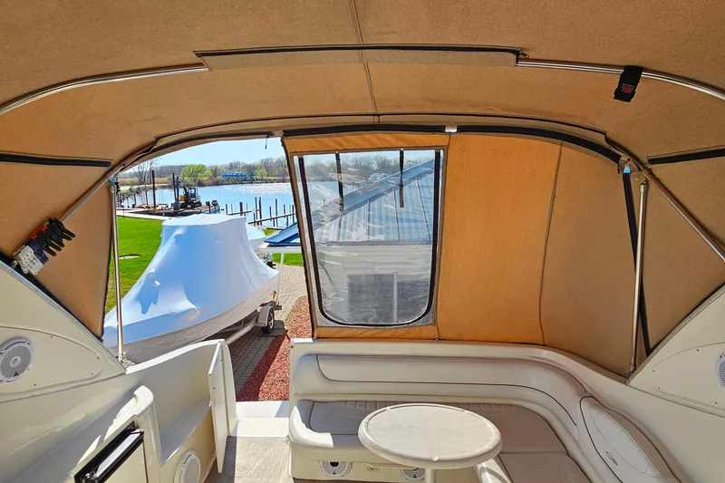 Slide: The Image of Interior view of a 2001 Maxum 3500 SCR boat with seating and table. - 22