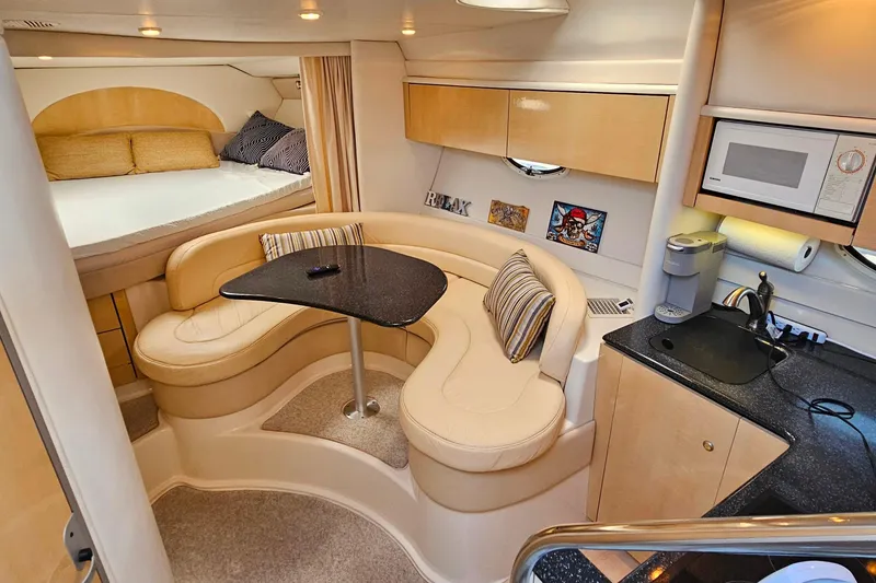Slide: The Image of Luxurious interior of 2001 Maxum 3500 SCR yacht with cozy seating and modern amenities. - 23