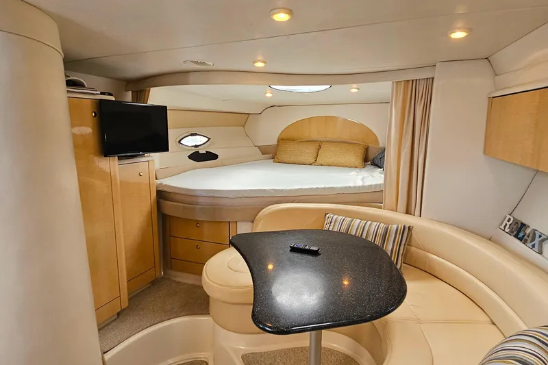 Slide: The Image of Interior of 2001 Maxum 3500 SCR yacht with cozy seating and bed area. - 25