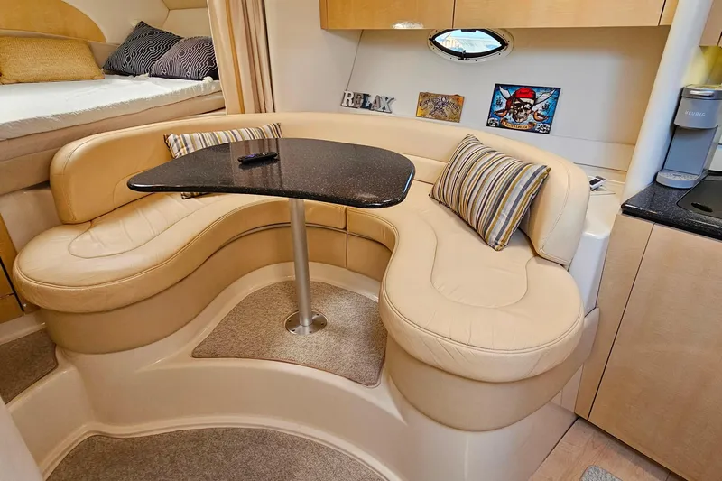 Slide: The Image of Luxurious interior of 2001 Maxum 3500 SCR yacht with cozy seating and elegant decor. - 26