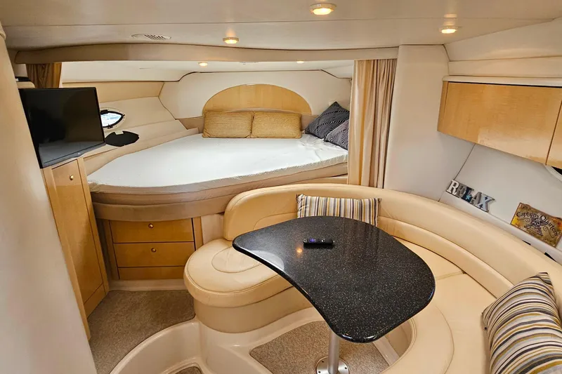 Slide: The Image of Luxurious interior of 2001 Maxum 3500 SCR yacht with cozy seating and modern amenities. - 31