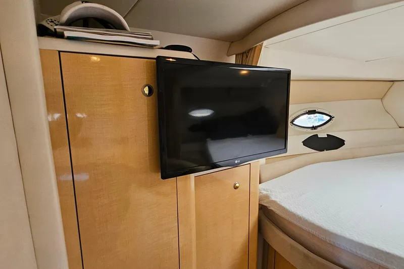 Slide: The Image of Interior of 2001 Maxum 3500 SCR yacht with TV and wooden cabinetry. - 32
