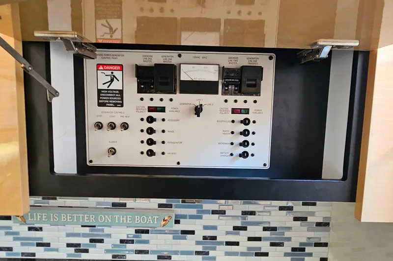Slide: The Image of Electrical control panel on a 2001 Maxum 3500 SCR boat, with decorative backsplash. - 36