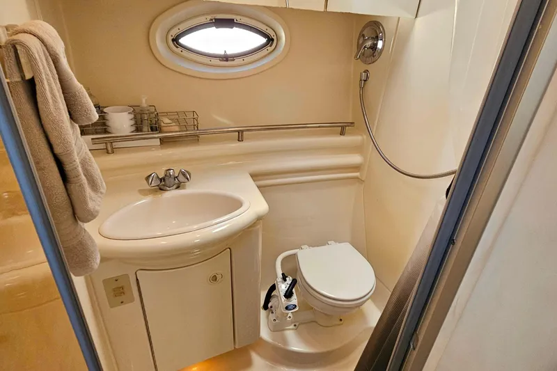 Slide: The Image of 2001 Maxum 3500 SCR yacht bathroom with sink, toilet, and shower. - 37