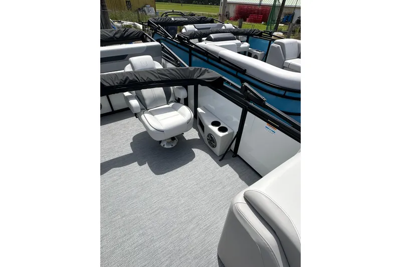 Slide: The Image of 2026 Godfrey Sweetwater 2286 SFLC boat interior with plush seating and cup holders. - 10