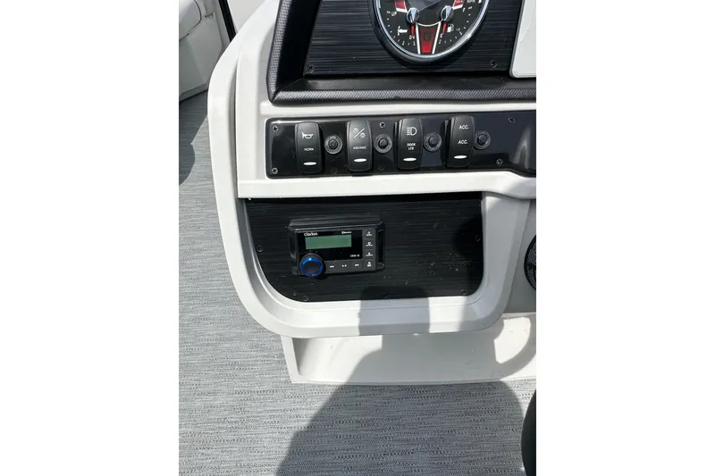 Slide: The Image of Control panel of 2026 Godfrey Sweetwater 2286 SFLC boat with switches and gauges. - 14