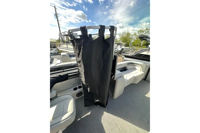 Slide: The Image of 2026 Godfrey Sweetwater 2286 SFLC boat interior with seating and storage bag. - 16