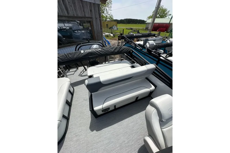 Slide: The Image of 2026 Godfrey Sweetwater 2286 SFLC pontoon boat interior with seating and cover. - 17