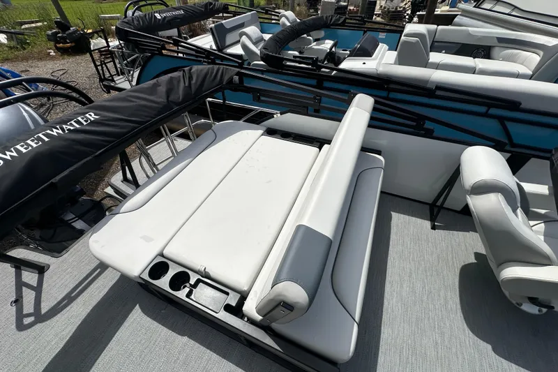 Slide: The Image of 2026 Godfrey Sweetwater 2286 SFLC pontoon boat interior with seating and cup holders. - 19