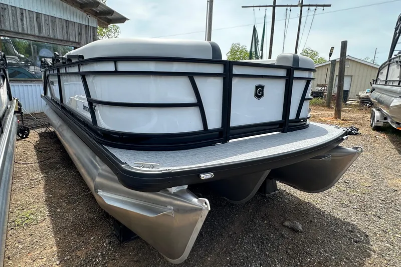 Slide: The Image of 2026 Godfrey Sweetwater 2286 SFLC pontoon boat, parked outdoors on gravel. - 2