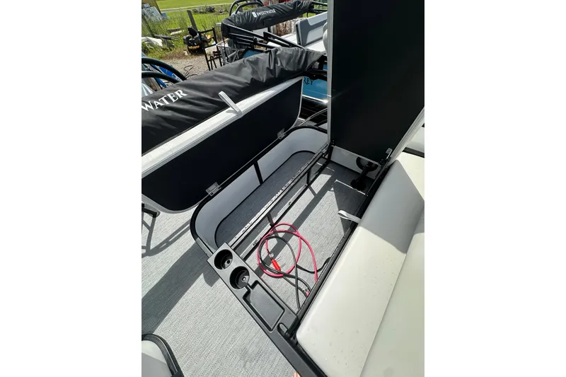 Slide: The Image of 2026 Godfrey Sweetwater 2286 SFLC boat interior with storage compartment open. - 23