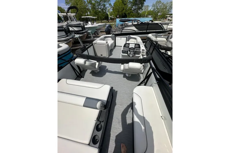 Slide: The Image of 2026 Godfrey Sweetwater 2286 SFLC pontoon boat interior with seating and steering console. - 27