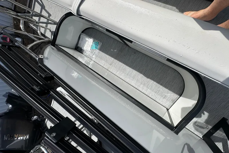Slide: The Image of Storage compartment on 2026 Godfrey Sweetwater 2286 SFLC boat, featuring sleek design and ample space. - 28