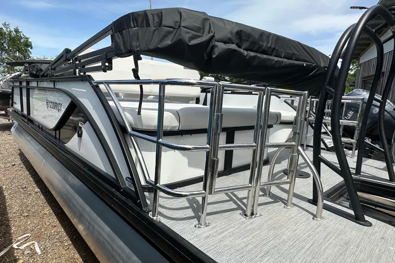 Slide: The Image of 2026 Godfrey Sweetwater 2286 SFLC pontoon boat with sleek design and comfortable seating. - 3
