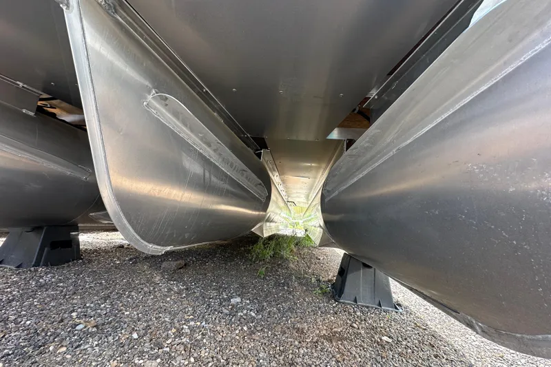 Slide: The Image of Underneath view of 2026 Godfrey Sweetwater 2286 SFLC pontoon boat on gravel. - 30
