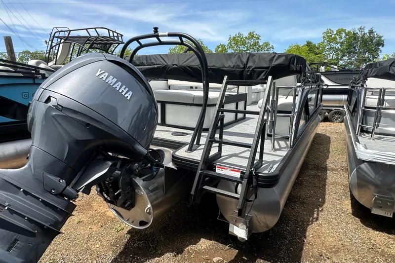 Slide: The Image of 2026 Godfrey Sweetwater 2286 SFLC pontoon boat with Yamaha motor, docked outdoors. - 5