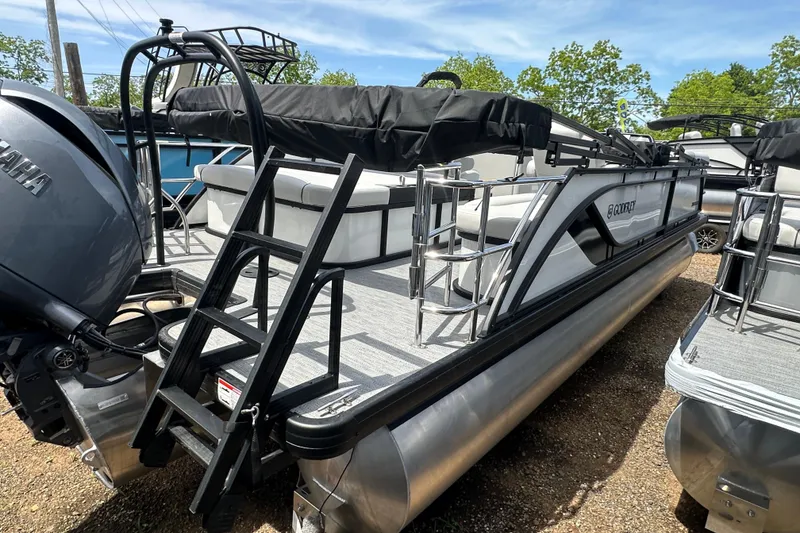 Slide: The Image of 2026 Godfrey Sweetwater 2286 SFLC pontoon boat with Yamaha engine, docked outdoors. - 6