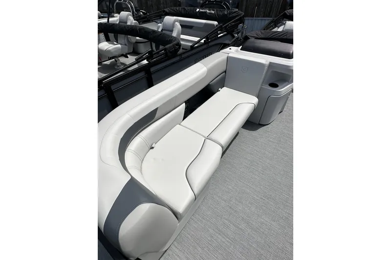 Slide: The Image of 2026 Godfrey Sweetwater 2286 SFLC boat interior with sleek white seating and modern design. - 7