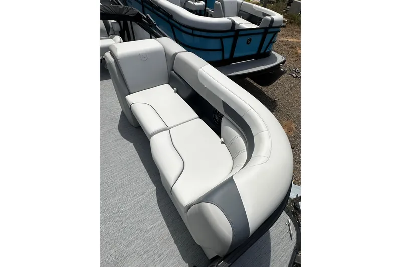 Slide: The Image of Luxurious seating on 2026 Godfrey Sweetwater 2286 SFLC pontoon boat, featuring sleek white upholstery. - 8