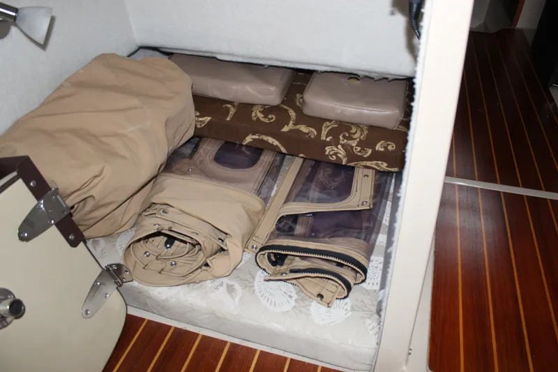 Slide: The Image of Interior storage area of a 2011 Ranger Tugs R-27 boat with folded covers. - 31