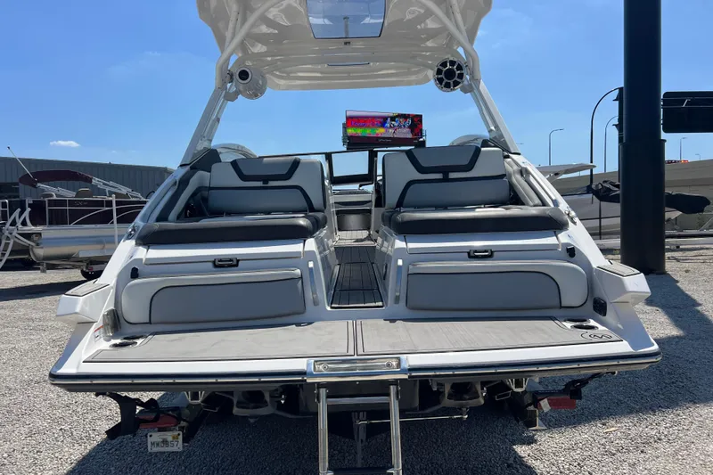 Slide: The Image of 2022 Yamaha 275 SD boat with sleek seating and modern design, displayed outdoors. - 5