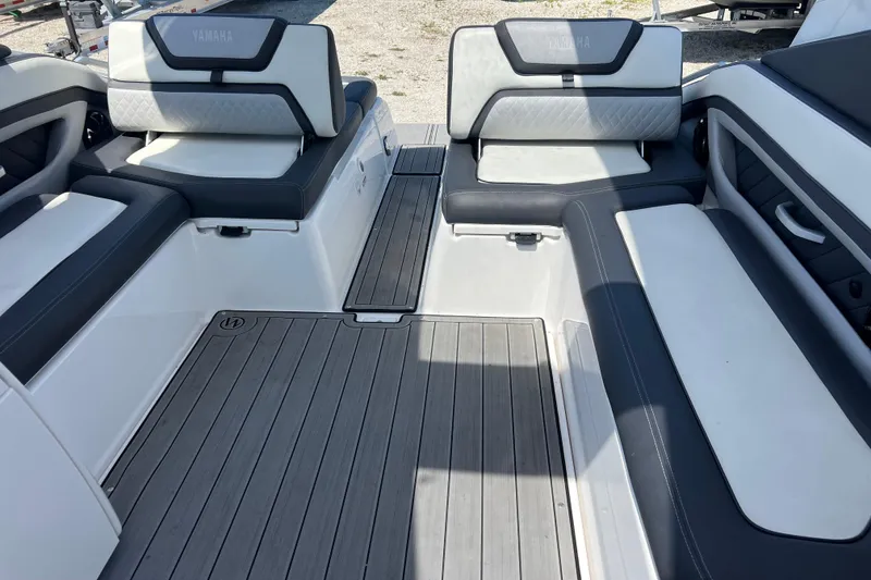 Slide: The Image of 2022 Yamaha 275 SD boat interior with sleek seating and modern design. - 7