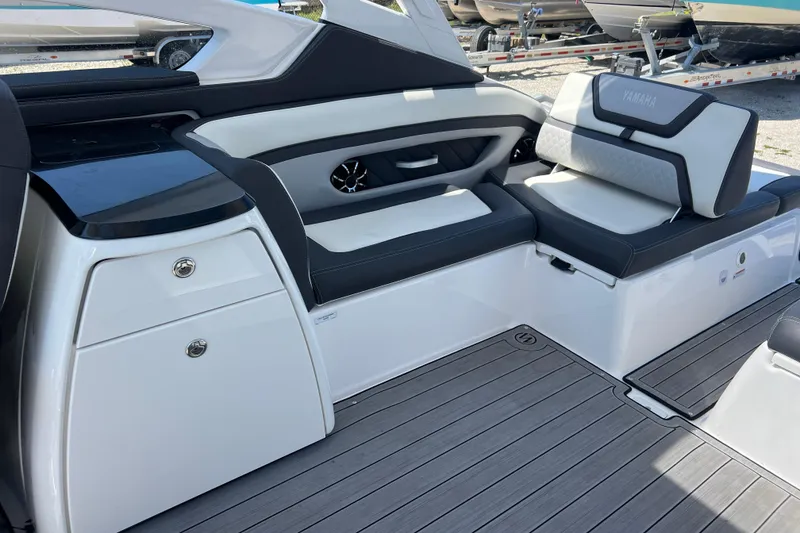 Slide: The Image of 2022 Yamaha 275 SD boat interior with sleek seating and modern design. - 8
