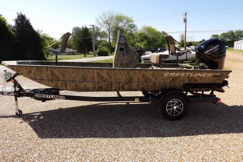 Slide: The Image of 2026 Crestliner 1860 Retriever CC boat with camouflage design on a trailer. - 11